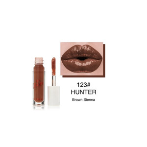 Lipstick with applicator in shade 123# Hunter, Brown Sienna, shown beside the bottle