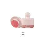 Phoera makeup bottle in soft pink with matching sponge applicator; shade 02 Heat.