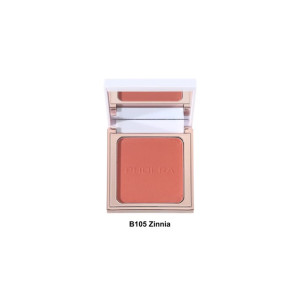 Open compact of coral-pink blush (B105 Zinnia) with mirror, showing embossed brand text and pan of powder.