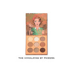 Makeup palette with nine warm-toned eyeshadows and retro illustrated cover featuring a woman; brand: The Himalayas by Phoera.